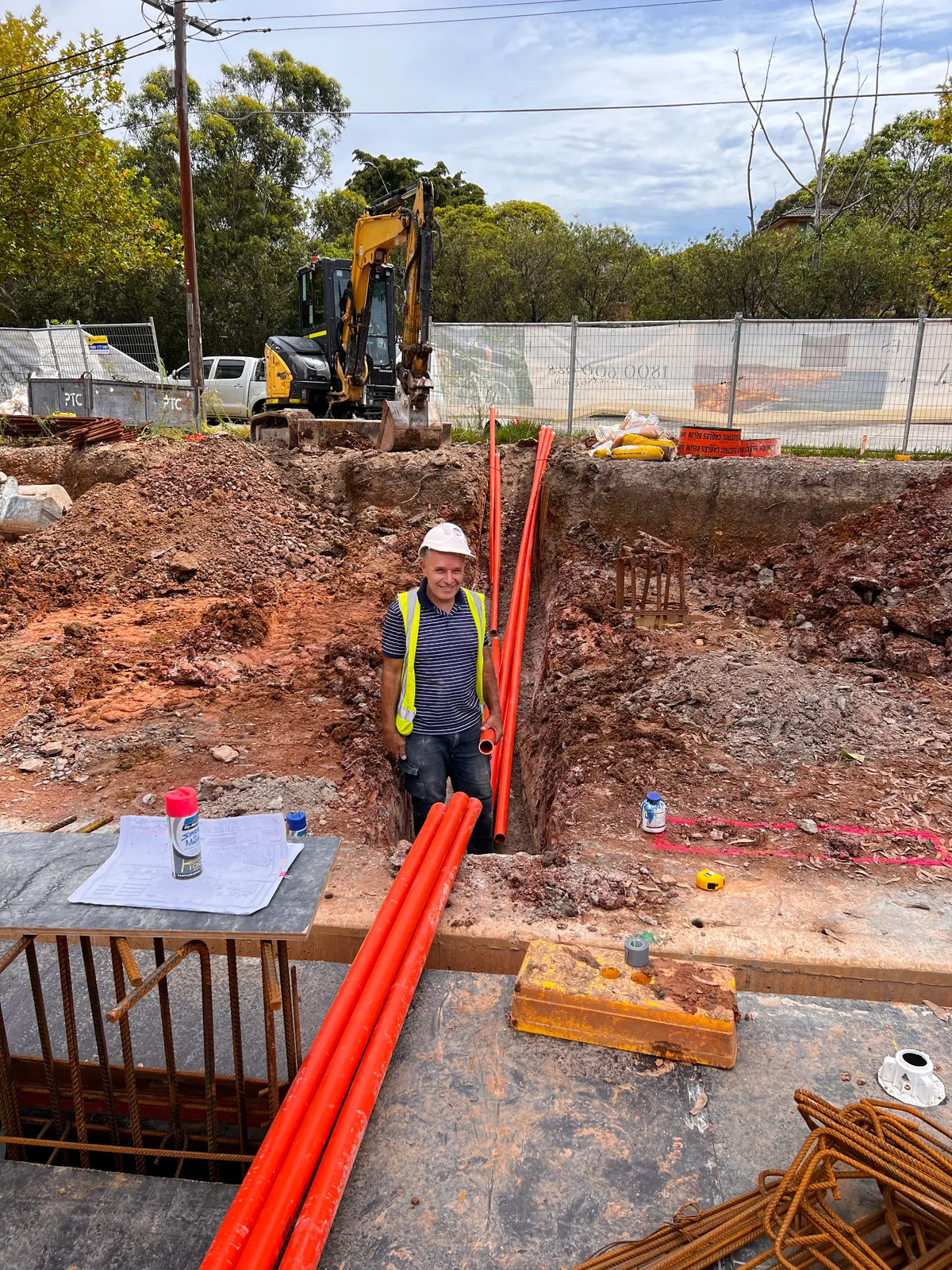 WA Electrical laying underground conduit on site